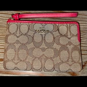 Coach wristlet with red wrist strap and pink details -brand new with tags.